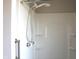 Bright shower stall with handheld sprayer and built-in shelving for bathroom accessories at 5582 E State Road 144, Mooresville, IN 46158