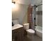 Bathroom with tiled shower/tub, sink and vanity at 5603 S Randolph St, Indianapolis, IN 46227