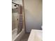 Bathroom with a bathtub/shower combo and decorative tile and curtain at 5603 S Randolph St, Indianapolis, IN 46227
