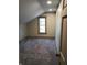 Cozy bedroom with plush carpeting and a window with wood trim, offering a warm and inviting atmosphere at 5603 S Randolph St, Indianapolis, IN 46227