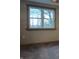 Bedroom window with carpeted floor and neutral color walls at 5603 S Randolph St, Indianapolis, IN 46227