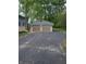 Exterior of the detached two-car garage featuring new garage doors and plenty of driveway parking space at 5603 S Randolph St, Indianapolis, IN 46227