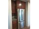 The kitchen features stainless steel appliances, granite countertops, and wood cabinets at 5603 S Randolph St, Indianapolis, IN 46227