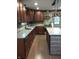 Spacious kitchen featuring granite countertops, stone backsplash, and stainless steel appliances at 5603 S Randolph St, Indianapolis, IN 46227