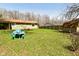 Lush backyard featuring a shed, creating an ideal setting for recreation and entertaining at 5909 Furnas Rd, Indianapolis, IN 46221
