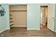A bedroom with open closet space and hard surface floors at 5909 Furnas Rd, Indianapolis, IN 46221