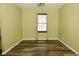 Bedrooom includes a ceiling fan and large window to let in lots of light at 5909 Furnas Rd, Indianapolis, IN 46221