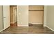 A bedroom with open closet space and hard surface floors at 5909 Furnas Rd, Indianapolis, IN 46221