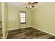 Bedroom with neutral walls, ceiling fan, and window with horizontal blinds at 5909 Furnas Rd, Indianapolis, IN 46221