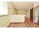 Open floor plan shows white cabinets, butcher block counter and stainless steel refrigerator at 5909 Furnas Rd, Indianapolis, IN 46221