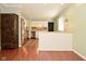 Charming kitchen featuring stainless steel appliances, custom cabinets and an adjacent living area at 5909 Furnas Rd, Indianapolis, IN 46221