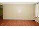 Spacious living room with wood-look flooring, neutral walls and natural light at 5909 Furnas Rd, Indianapolis, IN 46221