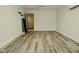 Neutral living room with durable flooring, offering versatile space for furnishings and decor at 5909 Furnas Rd, Indianapolis, IN 46221