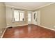 Cozy living room with wood-look flooring and natural light, near the front door at 5909 Furnas Rd, Indianapolis, IN 46221