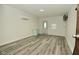 An airy living area with hard surface floors, a window, and a minimalist aesthetic at 5909 Furnas Rd, Indianapolis, IN 46221