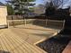 Spacious backyard featuring a new deck area with wooden railings at 5915 Winthrop Ave, Indianapolis, IN 46220