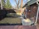A quaint backyard with a lawn of dead grass and a privacy fence at 5915 Winthrop Ave, Indianapolis, IN 46220