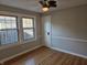 Bright bedroom with hardwood floors, dual windows, and a convenient closet at 5915 Winthrop Ave, Indianapolis, IN 46220