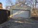 A single-car garage with siding and a paved driveway at 5915 Winthrop Ave, Indianapolis, IN 46220