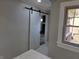 Hallway features a sliding barn door and a glimpse of stylish interior at 5915 Winthrop Ave, Indianapolis, IN 46220