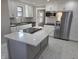 Beautiful kitchen with white cabinetry, subway tile backsplash, stainless steel appliances, and a center island at 5915 Winthrop Ave, Indianapolis, IN 46220
