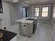 Modern kitchen featuring a center island with a cooktop and ample counter space at 5915 Winthrop Ave, Indianapolis, IN 46220