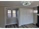 Living room features hardwood floors, a window, and double door closet at 5915 Winthrop Ave, Indianapolis, IN 46220