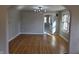 Spacious living room with hardwood flooring and abundant natural light at 5915 Winthrop Ave, Indianapolis, IN 46220