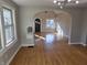 Inviting living room boasts abundant natural light and gleaming hardwood floors throughout at 5915 Winthrop Ave, Indianapolis, IN 46220