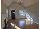 Living room features a stone fireplace, hardwood floors, and an abundance of natural light at 5915 Winthrop Ave, Indianapolis, IN 46220
