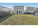 Backyard featuring grass, bare spots, a wood fence and a metal chain-link fence at 6663 Black Antler Cir, Indianapolis, IN 46217