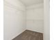 Walk-in closet with carpeting and wire shelving for storage at 6663 Black Antler Cir, Indianapolis, IN 46217