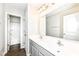 Bright bathroom featuring double sinks and a large mirror at 698 Ridge Gate Dr, Brownsburg, IN 46112