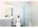 Neat bathroom with modern fixtures, painted vanity and tiled flooring at 698 Ridge Gate Dr, Brownsburg, IN 46112