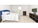 Cozy bedroom featuring a blue headboard, soft carpet, and a window view at 698 Ridge Gate Dr, Brownsburg, IN 46112