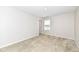 Bright bedroom with soft carpeting, a window and neutral paint at 698 Ridge Gate Dr, Brownsburg, IN 46112