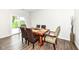 Bright dining room with hardwood floors and sliding glass door at 698 Ridge Gate Dr, Brownsburg, IN 46112