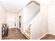 Bright entryway with carpeted stairs, wood floors and white painted doors at 698 Ridge Gate Dr, Brownsburg, IN 46112