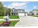 Beautifully landscaped two-story home with a spacious driveway and three-car garage at 698 Ridge Gate Dr, Brownsburg, IN 46112