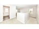 Bright hallway with carpeted floor, white trim, and natural light from the window at 698 Ridge Gate Dr, Brownsburg, IN 46112