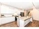 Bright kitchen features white cabinets, granite countertops and stainless steel appliances at 698 Ridge Gate Dr, Brownsburg, IN 46112