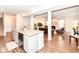 Open concept kitchen with island sink, dishwasher, and a view to the living room at 698 Ridge Gate Dr, Brownsburg, IN 46112