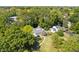 Aerial view of the home nestled among mature trees, highlighting its serene location at 6980 N Pennsylvania St, Indianapolis, IN 46220