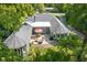 Aerial view of a patio area with an outdoor table, chairs, an umbrella, and a fire pit at 6980 N Pennsylvania St, Indianapolis, IN 46220