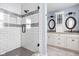 Bathroom featuring a glass shower door with white subway tile and light blue walls at 6980 N Pennsylvania St, Indianapolis, IN 46220