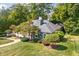 Charming home exterior with well-kept lawn and manicured landscaping at 6980 N Pennsylvania St, Indianapolis, IN 46220