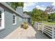 Charming exterior patio with white picket fence and comfortable seating areas, perfect for relaxing outdoors at 6980 N Pennsylvania St, Indianapolis, IN 46220