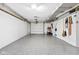 Spacious two car garage with epoxy flooring and a variety of tools and equipment at 6980 N Pennsylvania St, Indianapolis, IN 46220