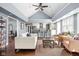 Open-concept living room featuring vaulted ceilings and a seamless flow to the modern kitchen and breakfast bar at 6980 N Pennsylvania St, Indianapolis, IN 46220