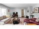 Comfortable living room with plush seating, a patterned rug, and a view of the home's inviting interiors at 6980 N Pennsylvania St, Indianapolis, IN 46220